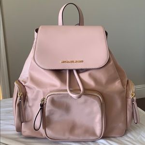 Pink Micheal kors backpack